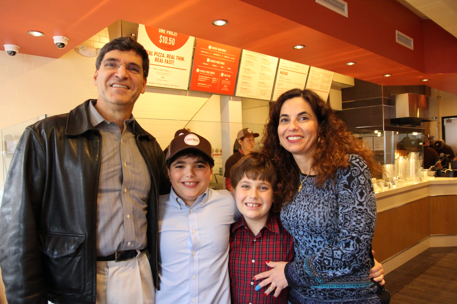 The Bouboulis family – Denis, Anthony, Alexander and Eleni in their new Skinny Pizza restaurant. April 4, 2018 Photo: Leslie Yager