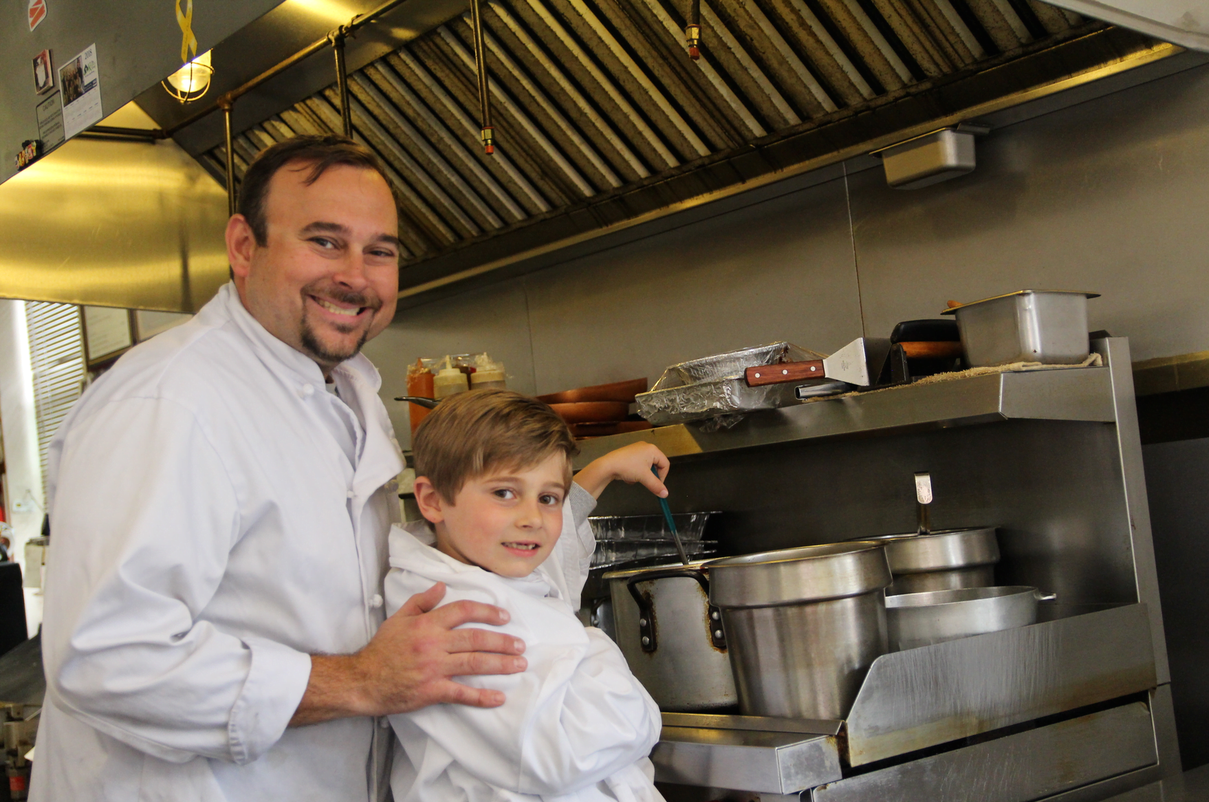 kevin Allmashy, Executive Chef/Owner Executive Corner Deli & Catering and his son Nicholas, who loves to help his dad with cooking. Mary 18, 2018 Photo: Leslie Yager
