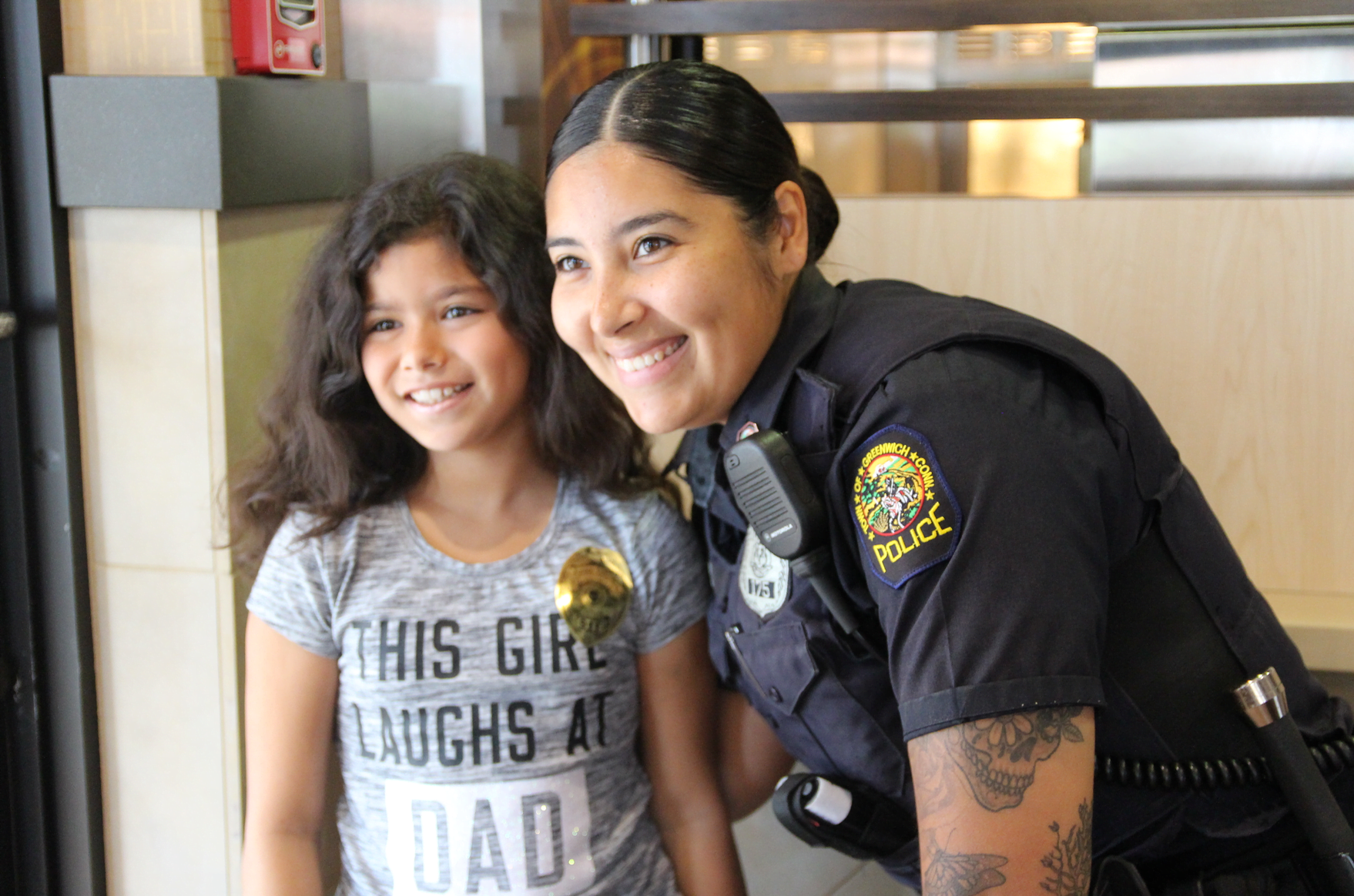 Isabella Ruggiero, 10, who stopped by McDonald's with her mother had a chance to ask Officer Garcia what is entailed in becoming a police officer.