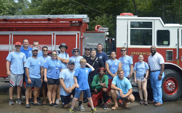 Camp staff and Fire Department volunteers gather after the action. Photo by: Alex LaTrenta