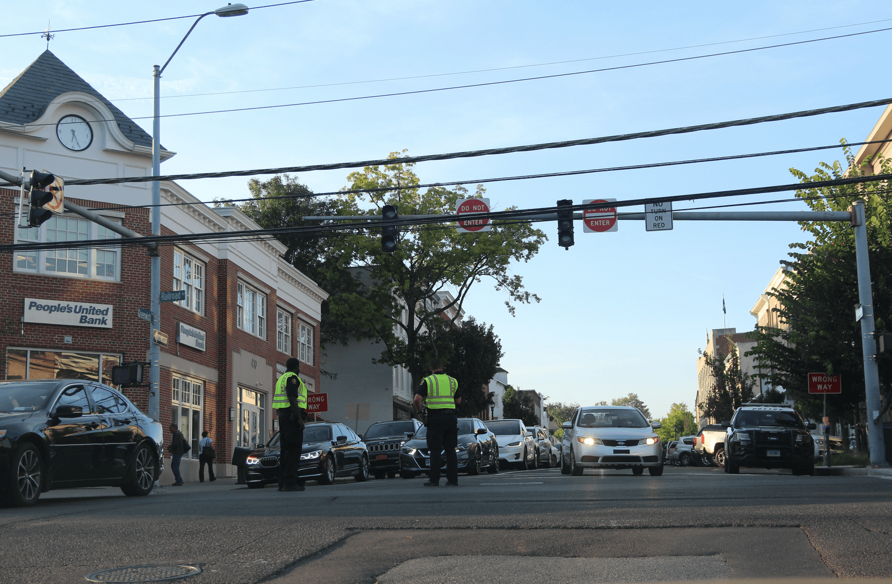 At the bottom of Greenwich Avenue at the intersection of Railroad Ave and Steamboat Road, the traffic light. Police are directing traffic which is jammed with commuters.