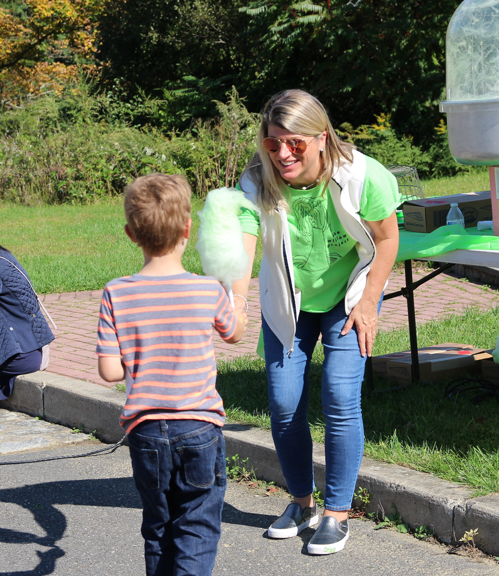 PJ Connolly handing out green cotton candy at the Indian Summer Children's Festival at Audubon Greenwich, Sept 30, 2018 Photo: Leslie Yager