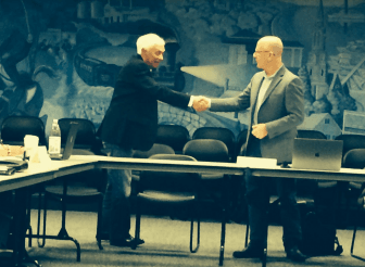 P&Z member and current chair, Richard Maitland (left) shakes hands with RTM Appointments committee chair John Eddy. Photo: Leslie Yager Oct 16, 2018