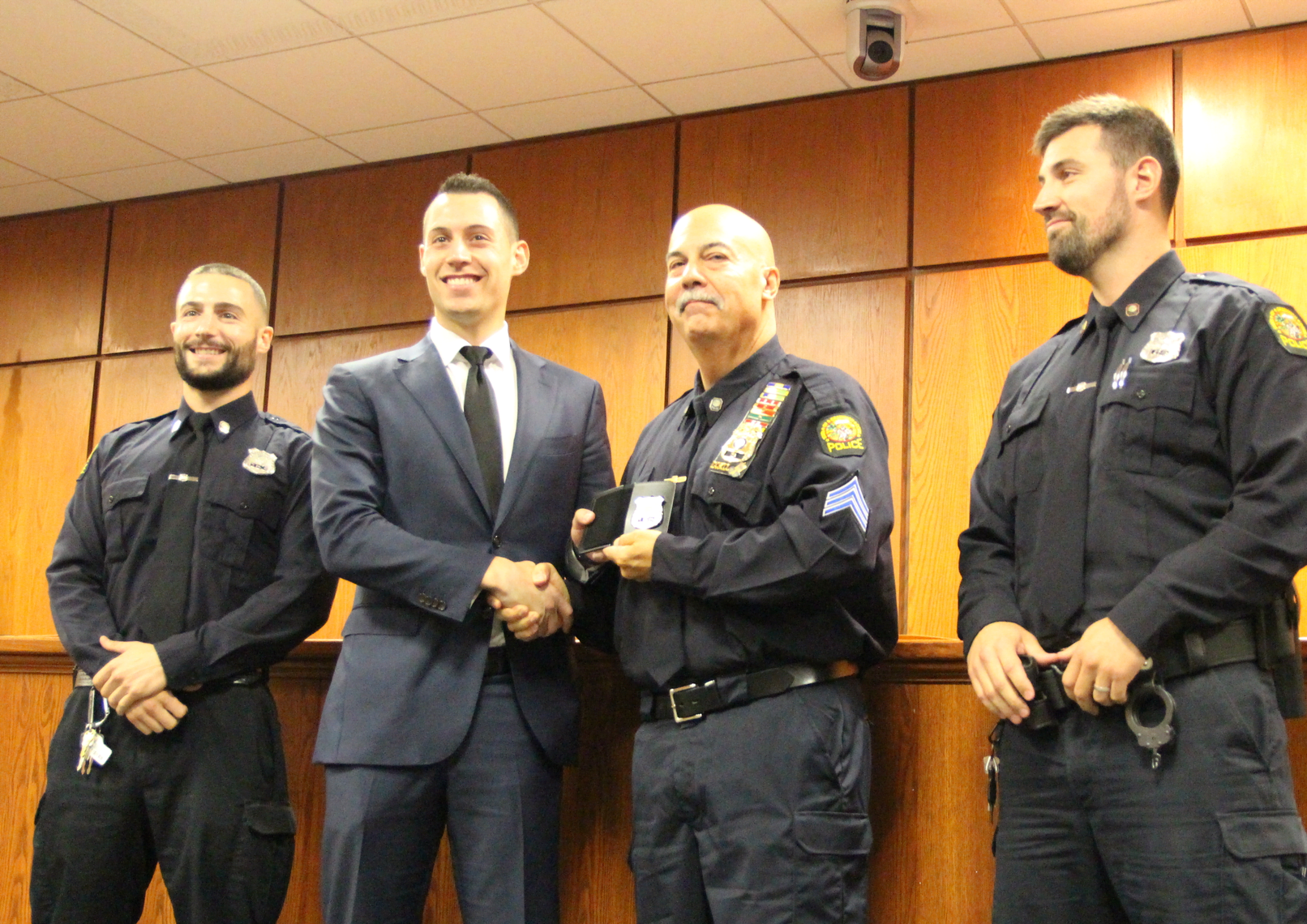 Newly sworn in Greenwich Police officer William O'Connor with his father Sergeant Michael O'Connor Sr flanked by brothers Patrick and Michael Jr., also both Greenwich Police officers. Oct 1, 2018 Photo: Leslie Yager