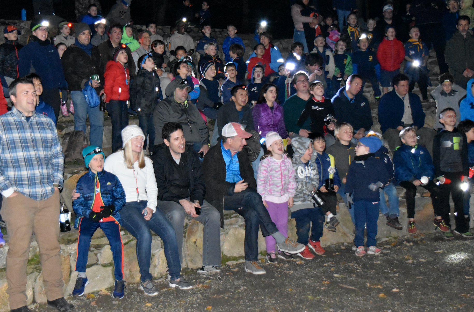 Cub Scouts and their families gather for campfire skits at the outdoor amphitheater at Greenwich Scouting's Fall Festival at Seton Scout Reservation.