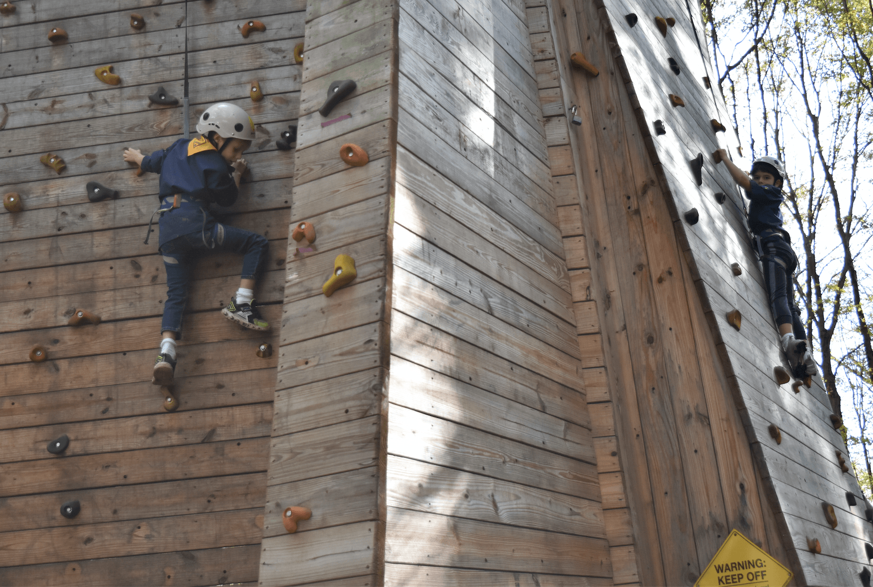 Cub Scouts ascend the climbing tower at Greenwich Scouting's Fall Festival at Seton Scout Reservation.