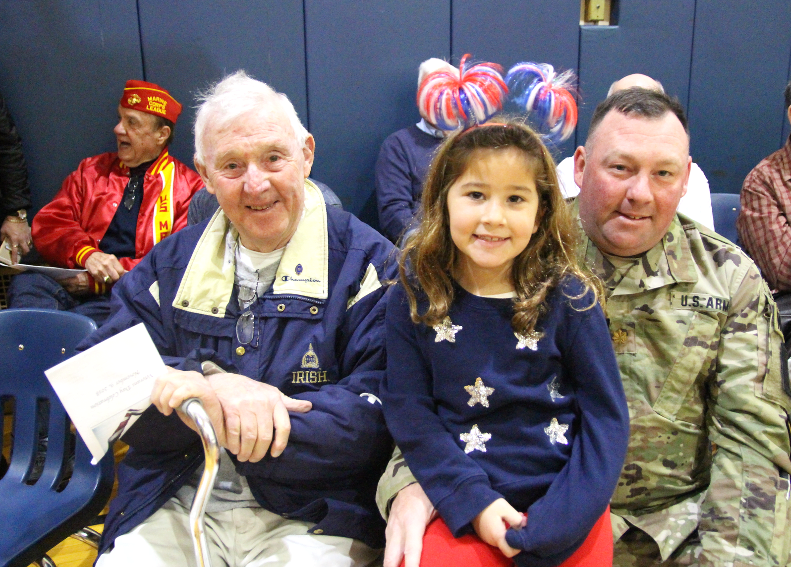 At North Mianus School Veterans Day ceremony are Greenwich Police Sgt. Sean O’Donnell, who served in the US Army, with daughter Keira and his father Denis who served from 1957-60 in the US Army in Germany. Nov 9, 2018 Photo: Leslie Yager