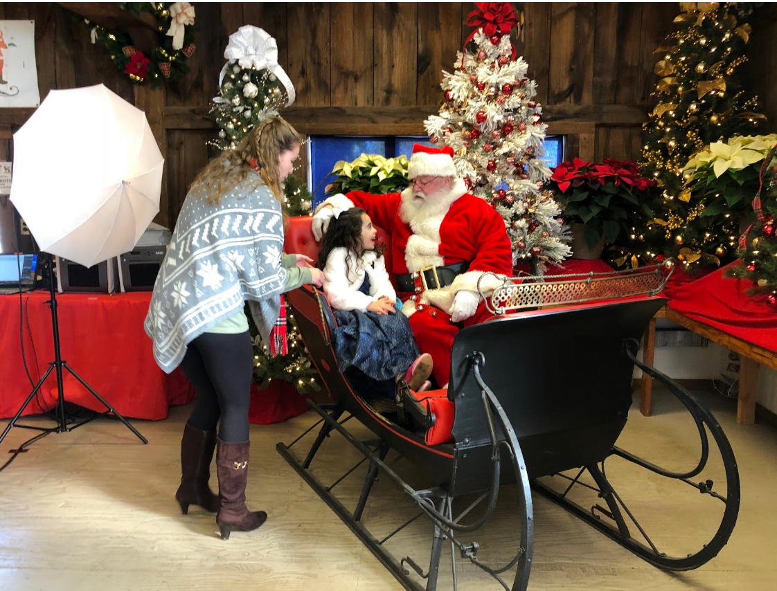 A young guest waits to take her picture with Santa Claus