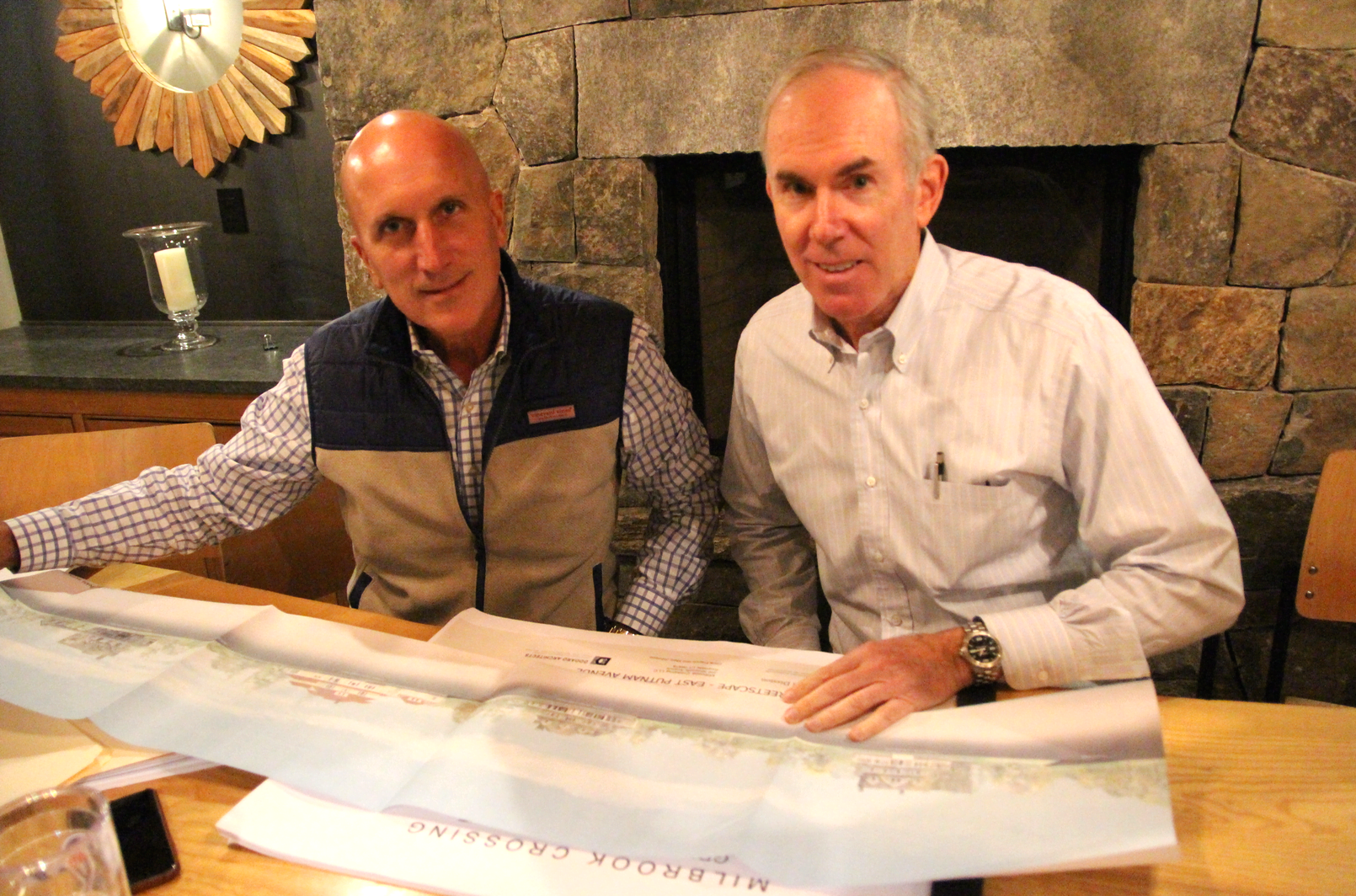Chris Franco with architect Mark Johnson with plans for Milbrook Crossing. Dec 7, 2018 Photo: Leslie Yager