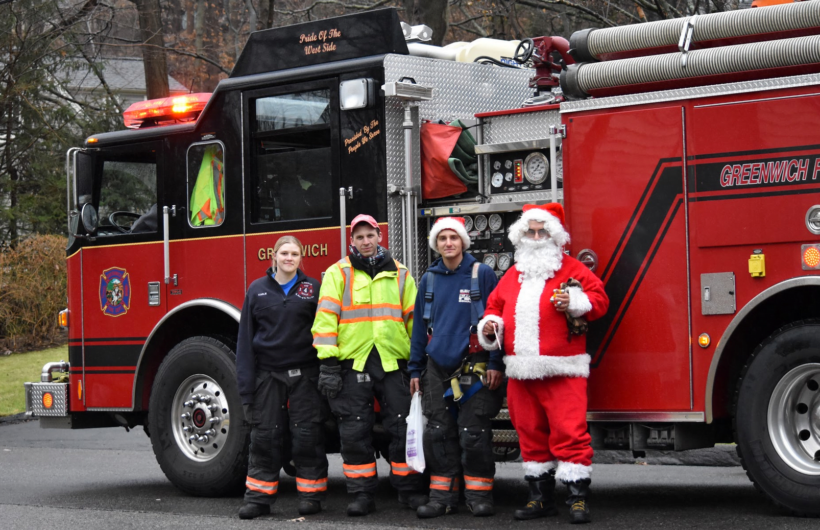 Glenville Volunteer Fire Company firefighters Karlie Darmochwa, Mark Horvath, Jeffrey Raiente and Santa (Martin Blanco). Dec 16, 2018 Photo: Heather Brown Lowthert