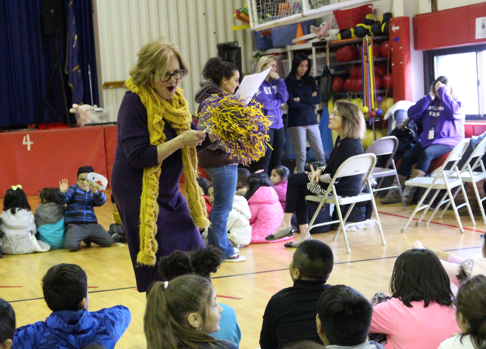 New Lebanon School principal Barbara Ricchio dressed in the school colors purple and gold, gets the kids excited for a celebration of school norms. Dec 19, 2018 Photo: Leslie Yager