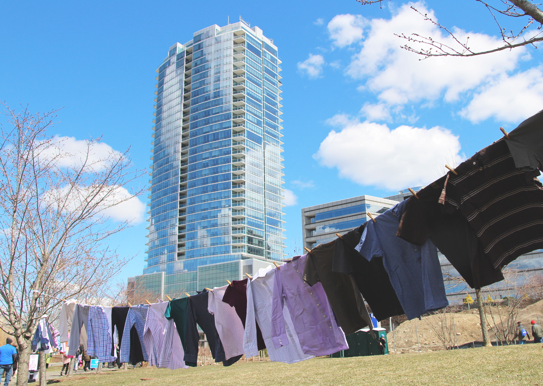 A total of 96 shirts were strung on clothes line along Mill River Park to represent the number of lives lost to guns every day in the US. Background, Trump Parc Stamford at 1 Broad Street. March 24, 2018 Photo: Leslie Yager
