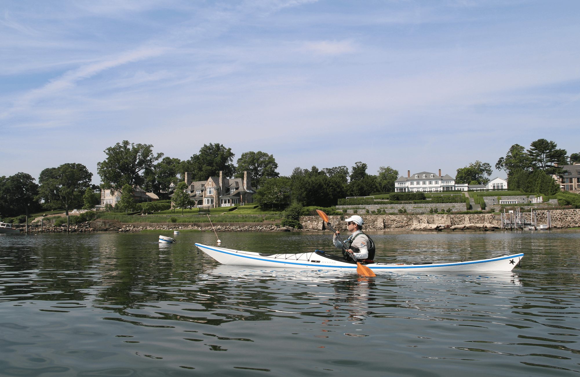 Taking photos from a kayak in Greenwich Harbor of the Town's ferries. August 2018 Photo: Leslie Yager