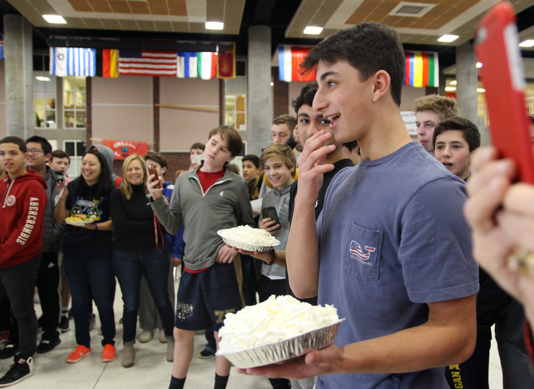 Jake Mondschein and James Sosa ready to pie Mr. Piotrzkowski after their houses won the the annual Thanksgiving penny wars and food drive at Greenwich High School. Nov 21, 2018 Photo: Leslie Yager