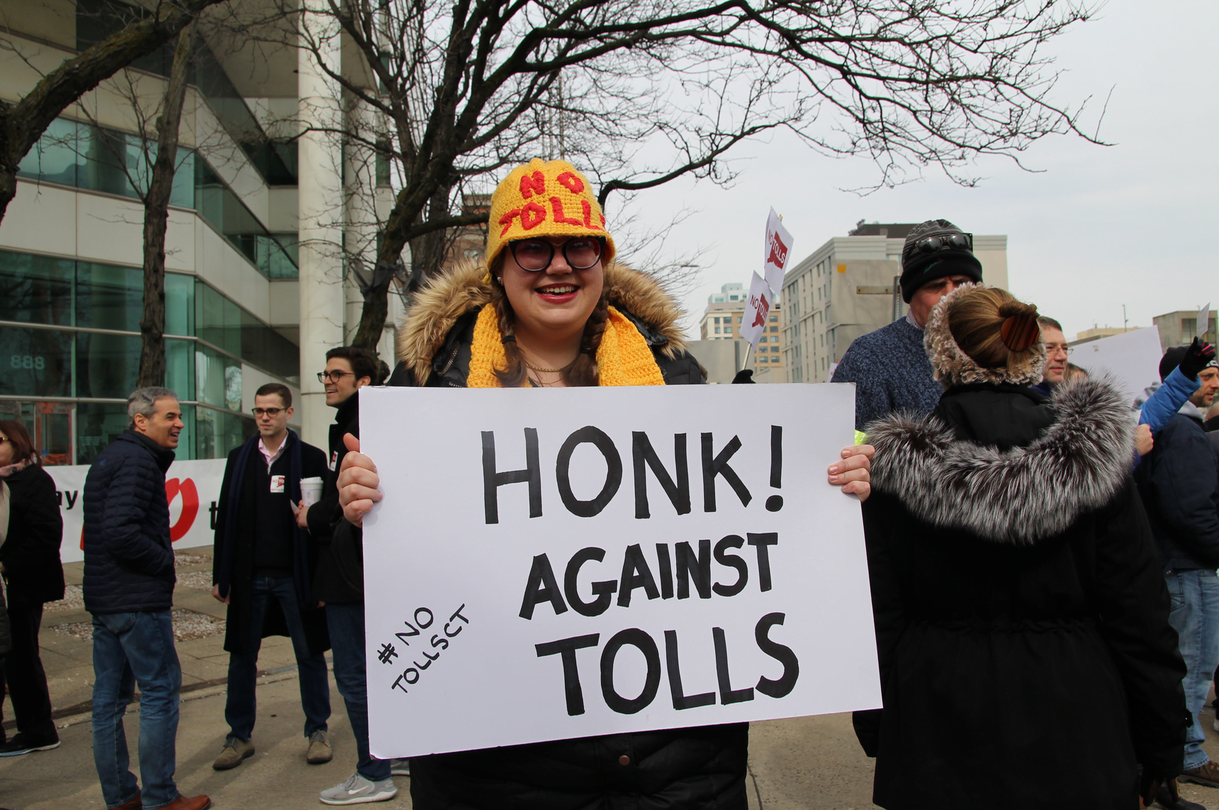 Hillary Gunn with a home made hat and protest sign at the anti-toll rally outside Stamford Government Center on Saturday, Feb 23, 2019 Photo: Leslie Yager