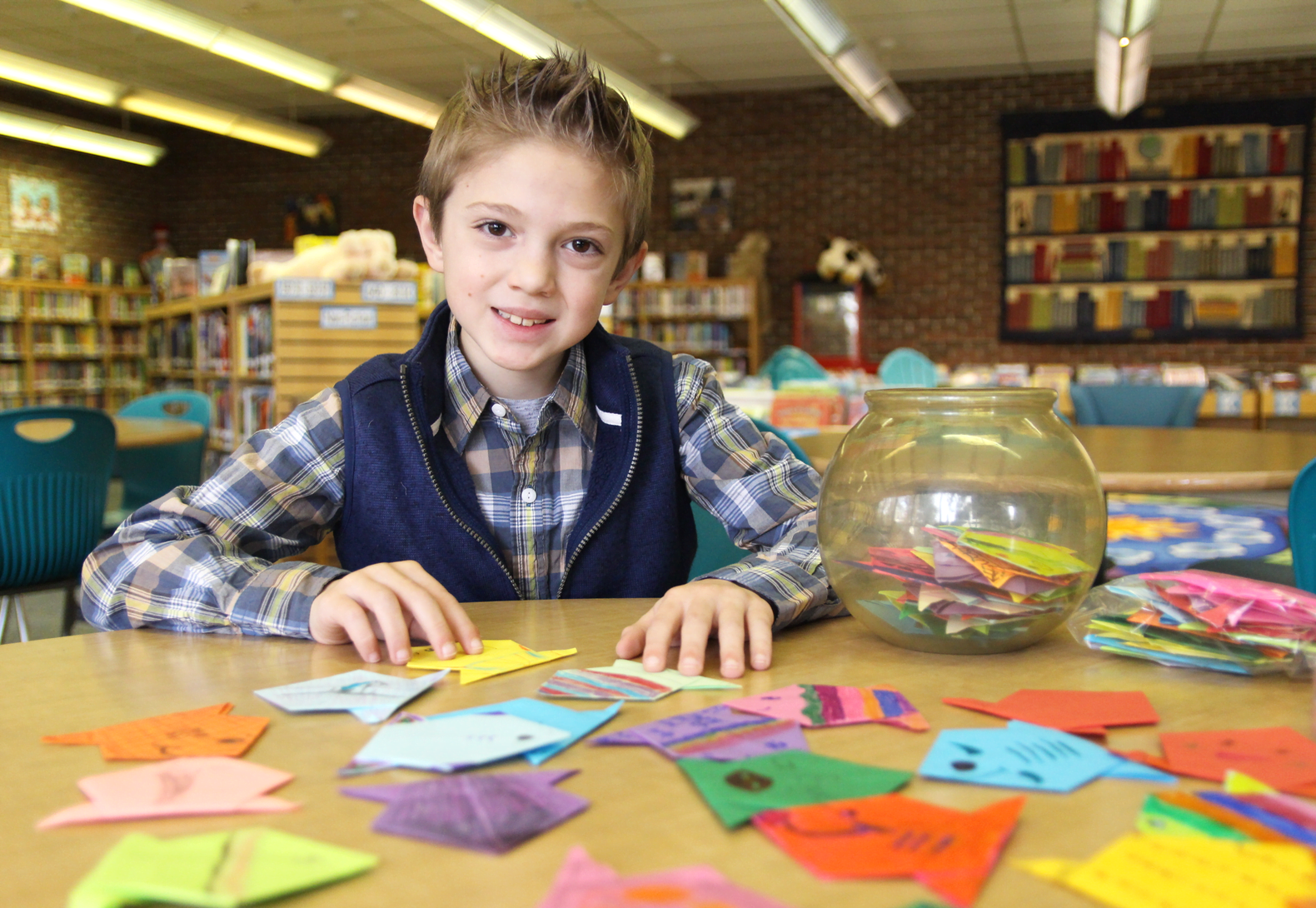 Kyler Woerz with some of the 551 origami fish he made – one for each student at North Mianus School. Feb 6, 2019 Photo: Leslie Yager