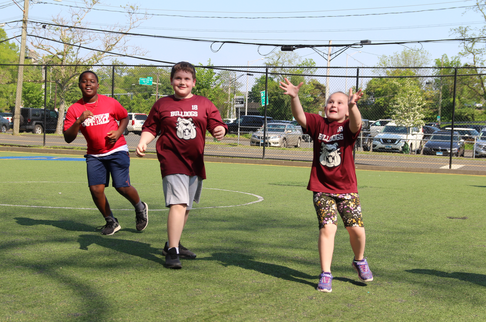 Greenwich Cardinals football team members worked with younger players during a clinic organized with the GYFL at the Boys & Girls Club of Greenwich. May 19, 2019 Photo: Leslie Yager 