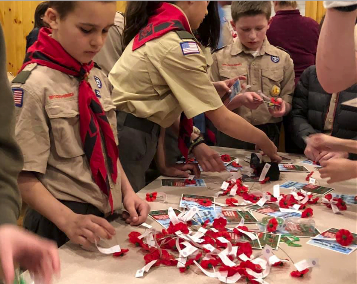 Scouts assemble poppy cards at Seton Scout Reservation in Greenwich