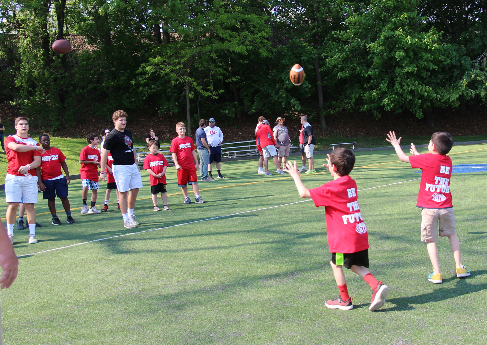 Greenwich Cardinals football team members worked with younger players during a clinic organized with the GYFL at the Boys & Girls Club of Greenwich. May 19, 2019 Photo: Leslie Yager