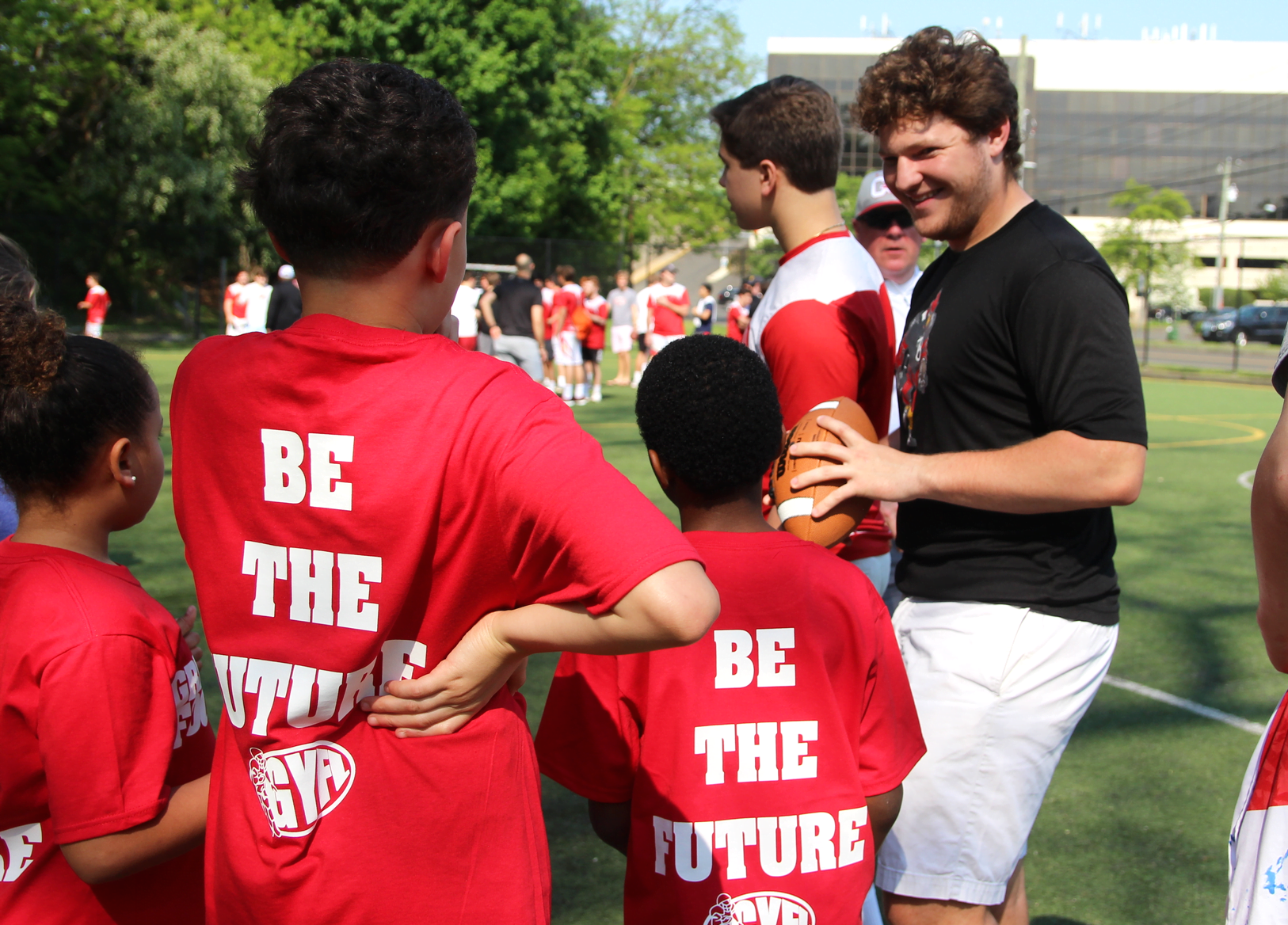 Greenwich Cardinals football team members worked with younger players during a clinic organized with the GYFL at the Boys & Girls Club of Greenwich. May 19, 2019 Photo: Leslie Yager