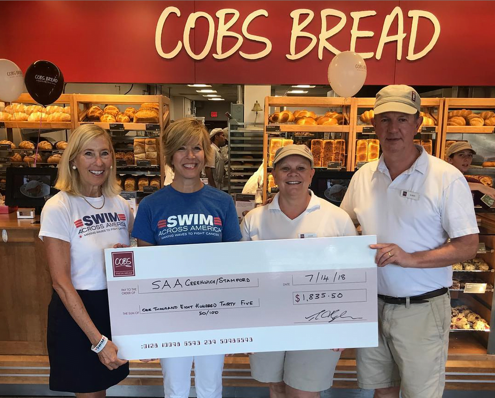 2018 Check presentation to Swim Across America from COBS Bread. L to R: Lorrie Lorenz and Nancy Carr with Swim Across America Fairfield County, and Louise and Robert Hyden of COBS Bread.