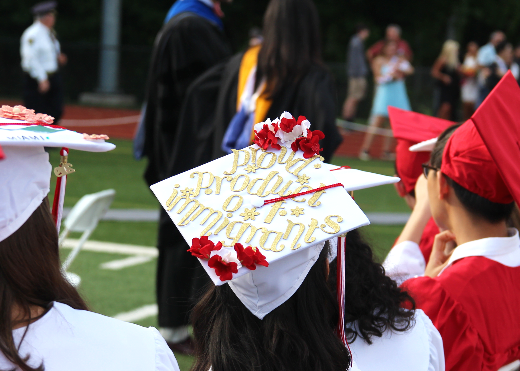"Proud product of Immigrants" on a mortar board at the GHS class of 2019 graduation. Photo: Leslie Yager
