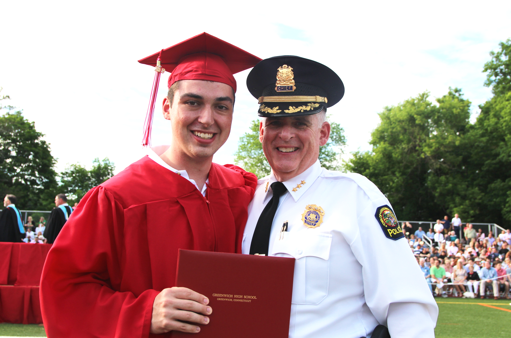 Greenwich Police Chief Jim Heavey with son James at the GHS Class of 2019 graduation. June 18, 2019 Photo: Leslie Yager