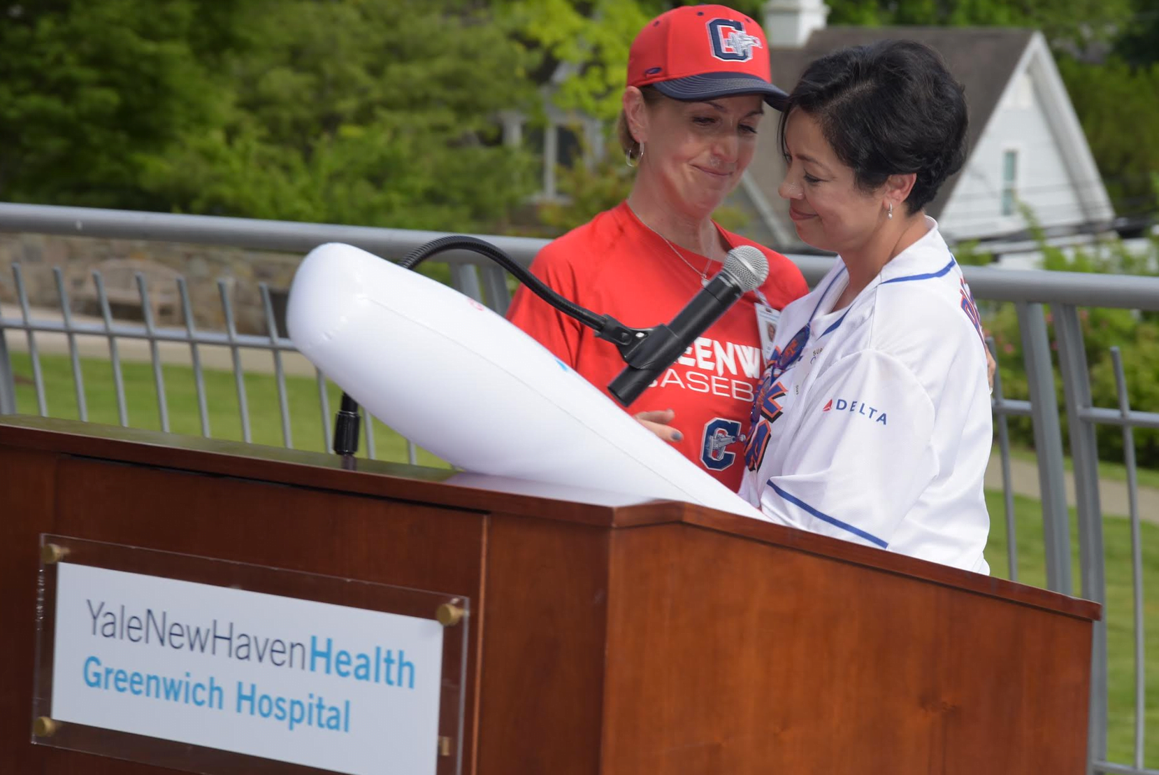 Cancer survivor Carmen Elledias, right, shared a tender moment with Lynn Carbino, RN, during Greenwich Hospital’s “Swing into Survivorship” celebration last week. 