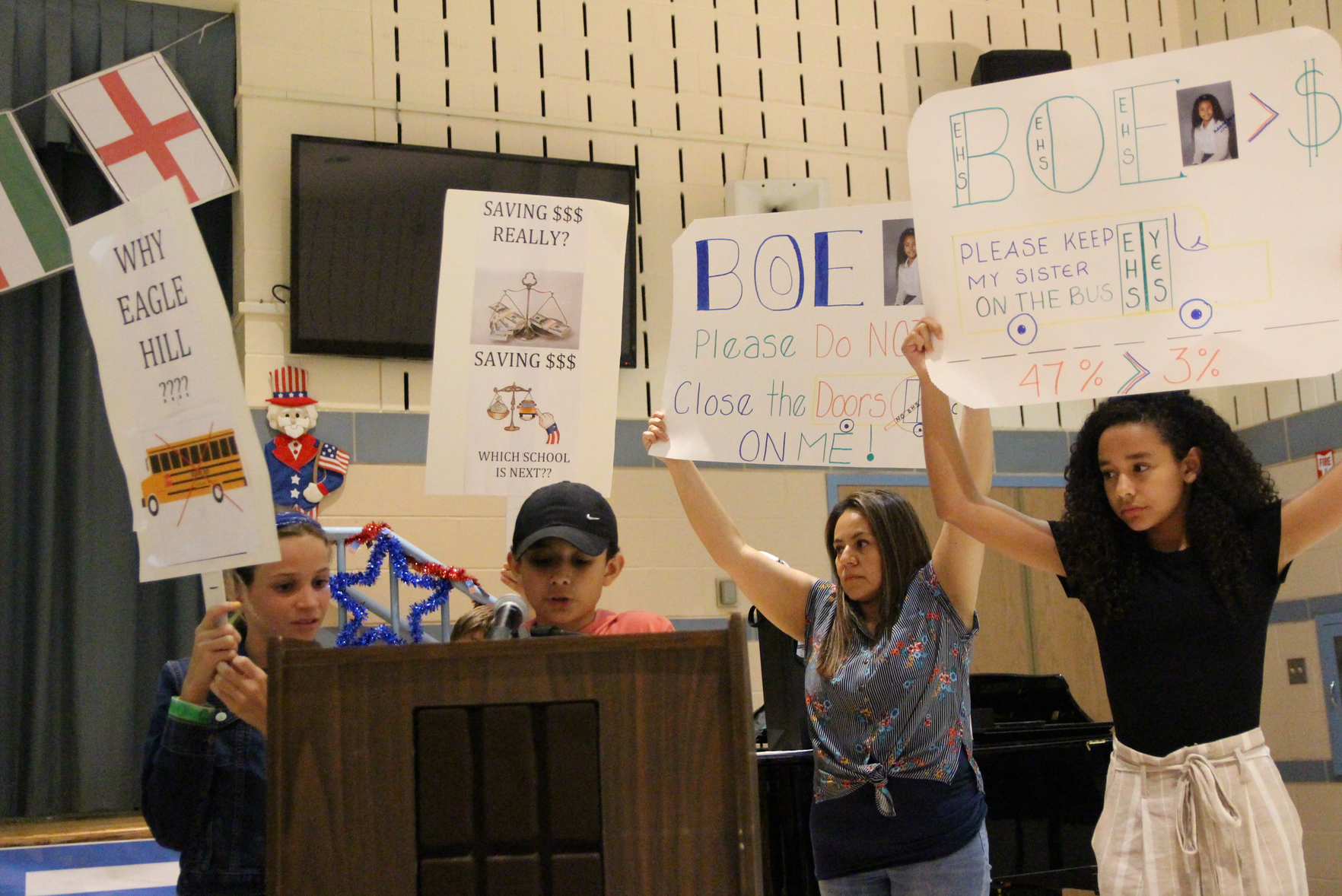 Families took the opportunity to voice their objection to loss of transportation to Eagle Hill School during the public hearing portion of the June, 2019 BOE meeting at Cos Cob School. June 13, 2019. Photo: Leslie Yager