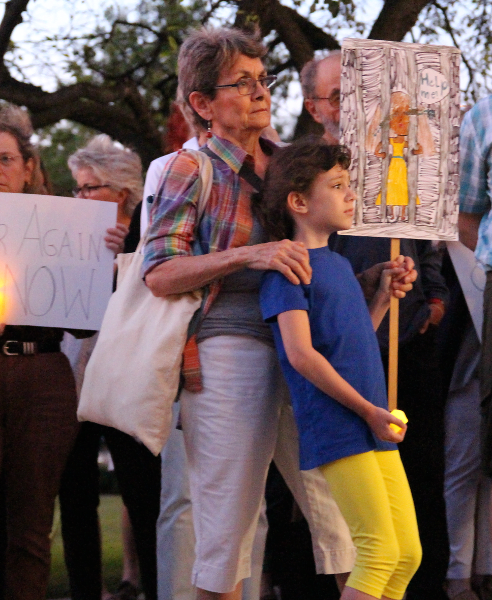 About 250 people attended a "Lights for Liberty" vigil at Greenwich Town Hall to protest the treatment of migrants on the US border with Mexico. July 12, 2019 Photo: Leslie Yager