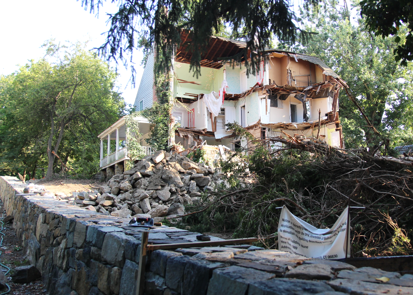 Demolition of the "ghost house" at 2 Patterson property, owned by Greenwich Academy. Aug 20, 2019. Photo: Leslie Yager