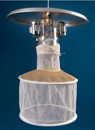 (image of light trap from CDC website ) -CDC light traps use dry ice which emits carbon dioxide. Feeding mosquitos are attracted to the carbon dioxide and are pulled into the net by a fan connected to a dry ice thermos. These traps can yield as many as 30,000 mosquitos in one night which can then be tested for viruses.