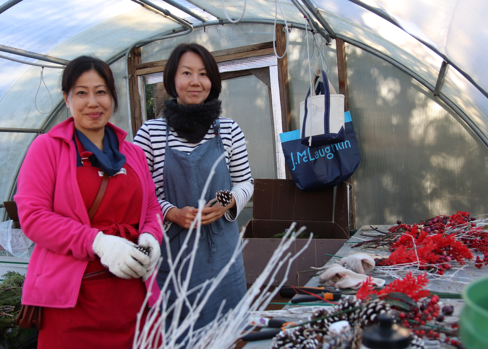 Etsuko Tulloch and Yoko Takata arranging some of the portions of greenery baskets that are recycled year to year. Nov 21, 2019 Photo: Leslie Yager