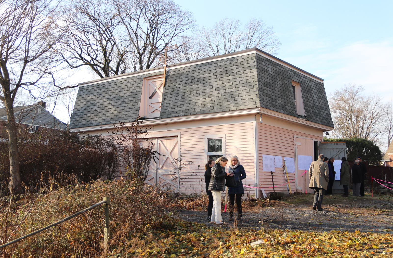 Front of existing carriage house at 0 Strickland Rd. Look close and see there is a stick attached to the roof to show the height of the proposed roof. Nov 25, 2019 Photo: Leslie Yager