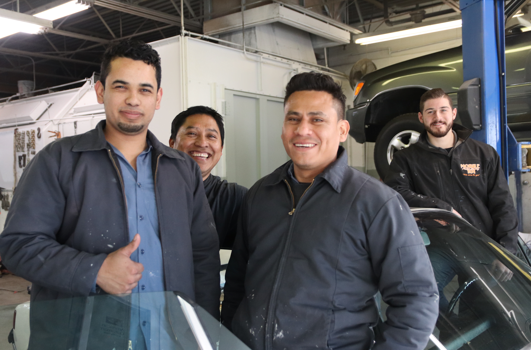 John Castellana Jr and some of his auto technicians at 368 West Ave in Stamford. Jan 21, 2020. Photo: Leslie Yager