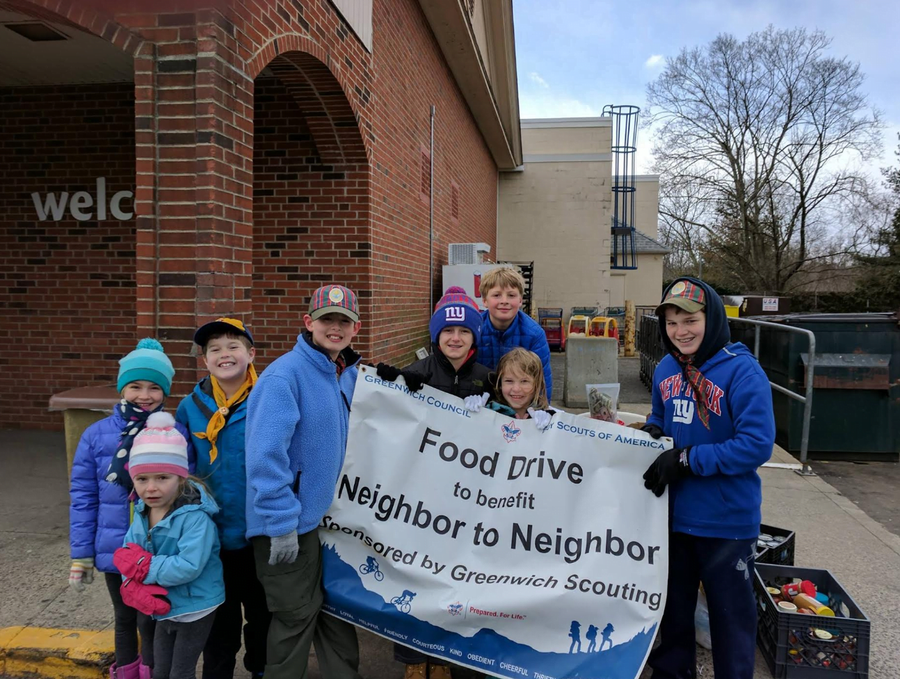 Local Scouts collect Scouting for Food donations outside West Putnam Avenue Stop & Shop to deliver to Neighbor to Neighbor's food pantry.