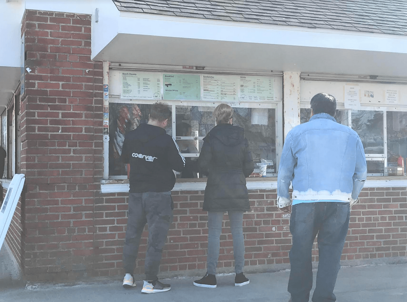 Customers attempt social distancing at the concession stand at Tod's Point. March 21, 2020 Photo: Leslie Yager