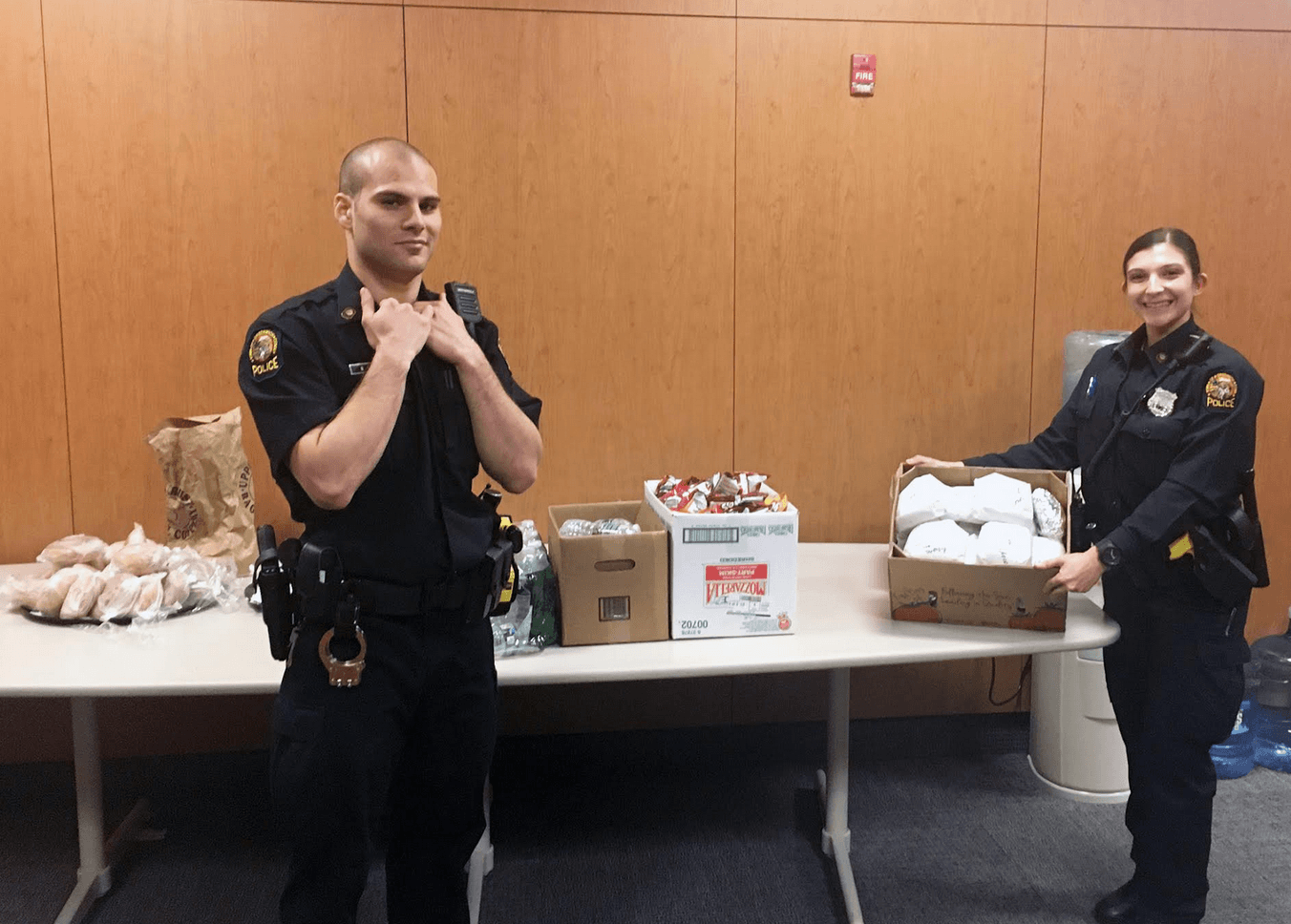Greenwich police officers with food donated by Boys & Girls Club of Greenwich’s Torch Club
