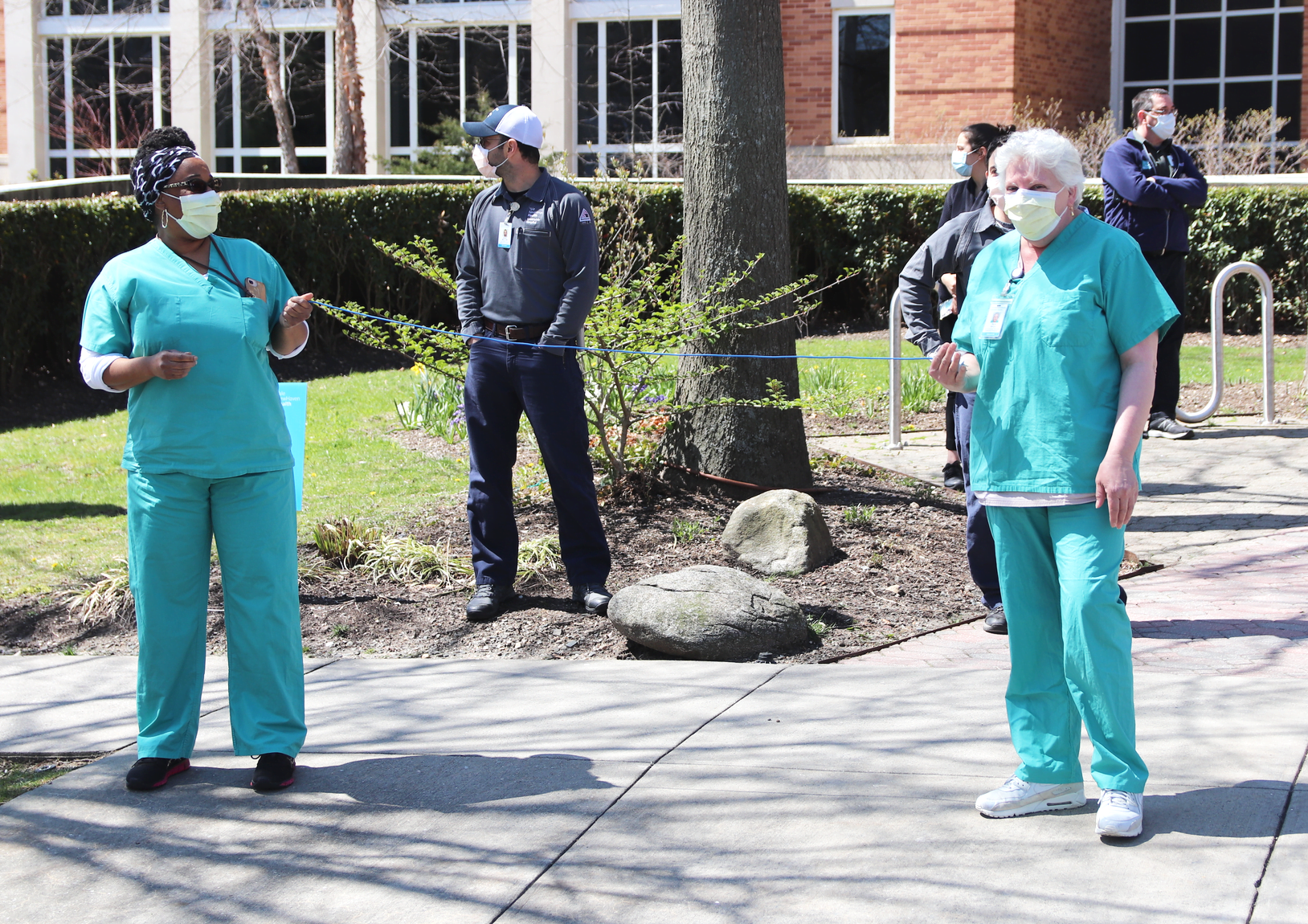 Greenwich Hospital staff demonstrate what safe social distancing of 6 ft looks like. April 15, 2020 Photo: Leslie Yager